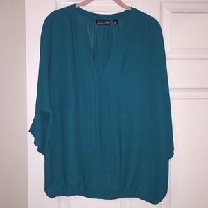 Pleated banded bottom blouse